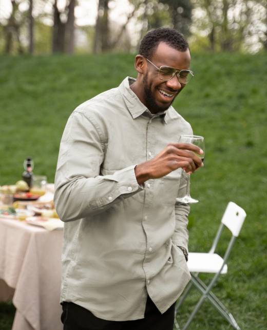 medium-shot-smiley-man-holding-glass